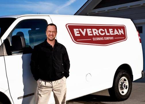 Darrin, the owner of Everclean Cleaning Company, standing beside the Everclean service van